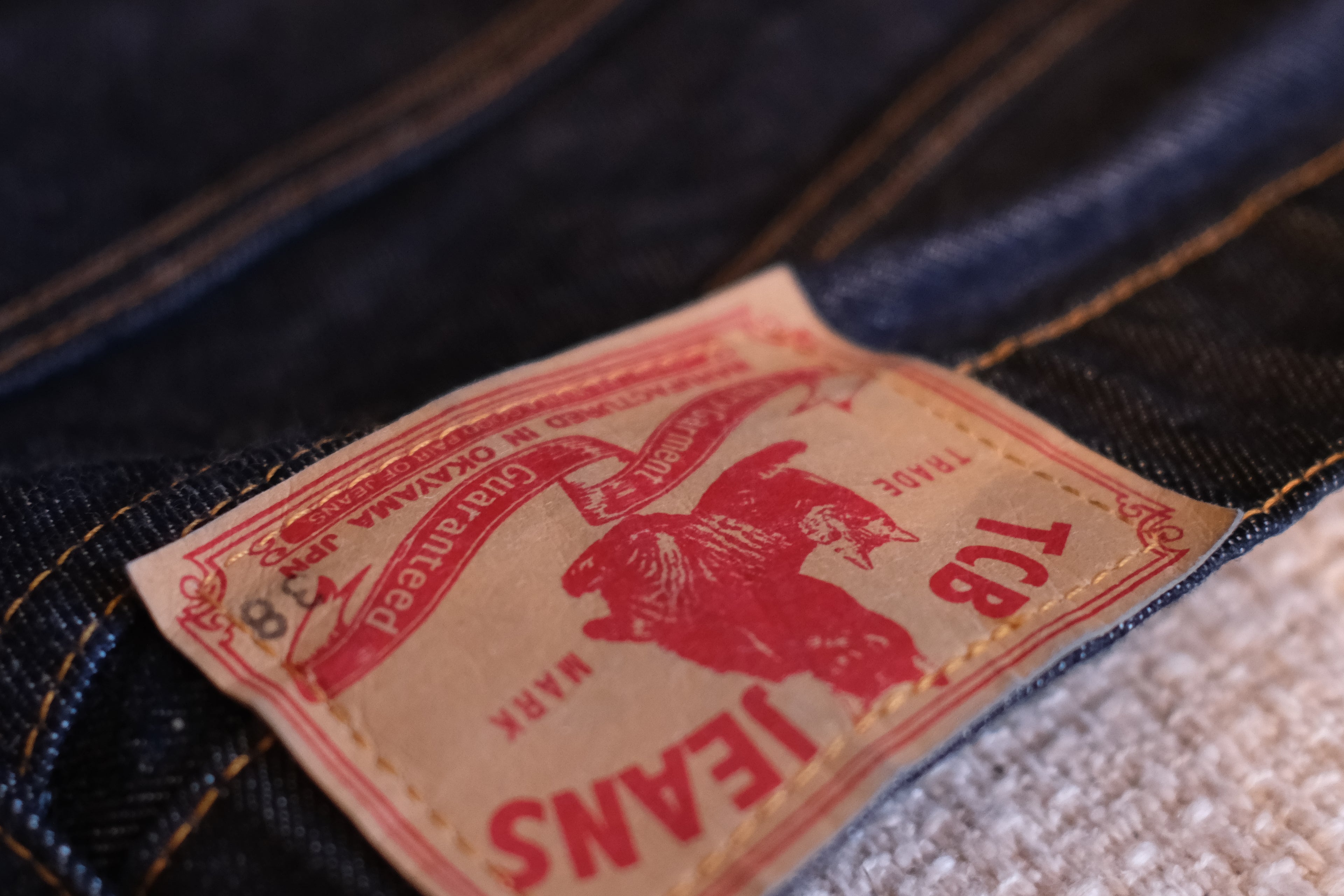 Close-up of a Levi's jeans label on denim fabric.