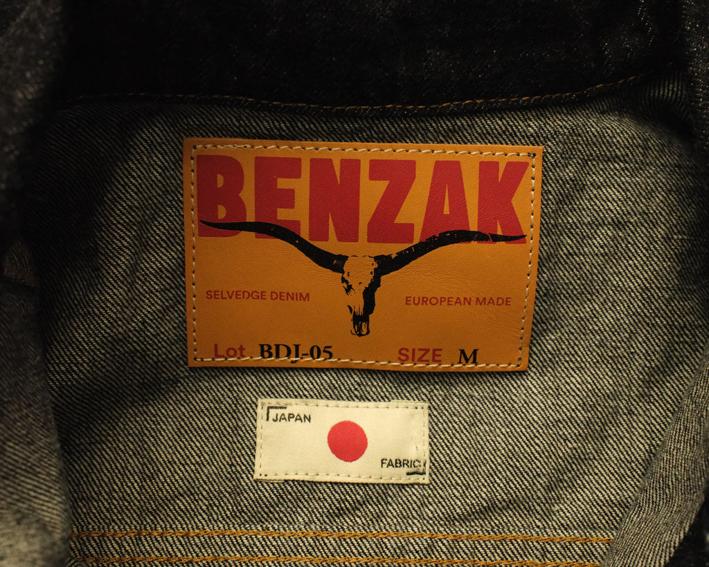 Benzak denim label on a garment with a red dot in Japan fabric tag.